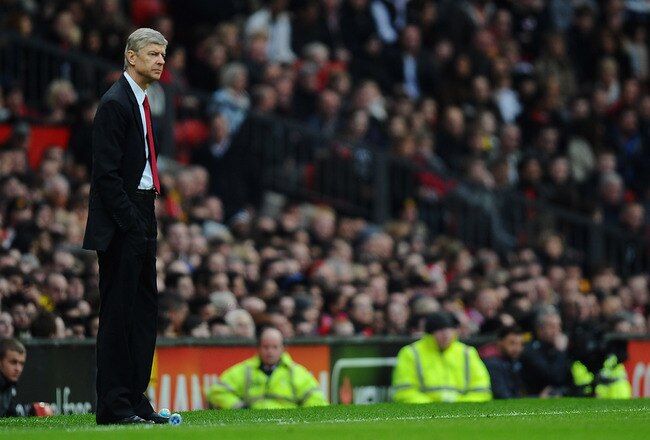 MANCHESTER, ENGLAND - MARCH 12:  Arsenal manager Arsene Wenger looks on during the FA Cup sponsored by E.On Sixth Round match between Manchester United and Arsenal at Old Trafford on March 12, 2011 in Manchester, England.  (Photo by Clive Mason/Getty Images)