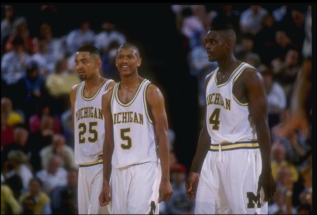 8 Mar 1992: Michigan Wolverines forward Juwan Howard, guard Jalen Rose, and forward Chris Webber (l to r) look on during a game against the Indiana Pacers.