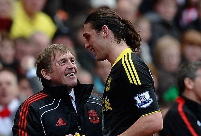 SUNDERLAND, ENGLAND - MARCH 20:  Andy Carroll of Liverpool shares a joke with manager Kenny Dalglish as he is substituted during the Barclays Premier League match between Sunderland and Liverpool at the Stadium of Light on March 20, 2011 in Sunderland, England.  (Photo by Laurence Griffiths/Getty Images)