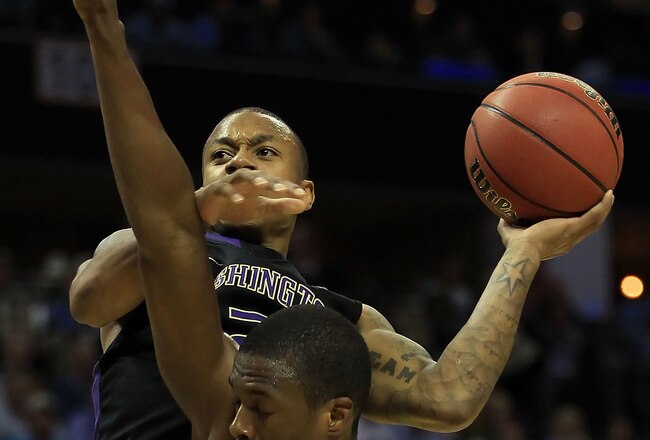 CHARLOTTE, NC - MARCH 20:  Isaiah Thomas #2 of the Washington Huskies goes up for a shot over Harrison Barnes #40 of the North Carolina Tar Heels in the second half during the third round of the 2011 NCAA men's basketball tournament at Time Warner Cable Arena on March 20, 2011 in Charlotte, North Carolina.  (Photo by Streeter Lecka/Getty Images)
