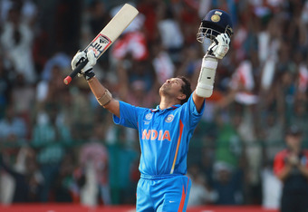 BANGALORE, INDIA - FEBRUARY 27:  Sachin Tendulkar of India celebrates reaching his century during the 2011 ICC World Cup Group B match between India and England at M. Chinnaswamy Stadium on February 27, 2011 in Bangalore, India.  (Photo by Tom Shaw/Getty Images)