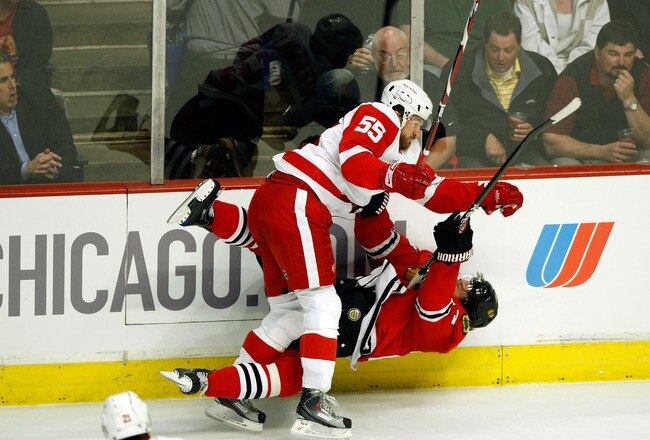 CHICAGO - MAY 22:  Martin Havlat #24 of the Chicago Blackhawks checked hard to the ice by Niklas Kronwall #55 of the Detroit Red Wings during the first period of Game Three of the Western Conference Championship Round of the 2009 Stanley Cup Playoffs on May 22, 2009 at the United Center in Chicago, Illinois.  (Photo by Jim Prisching/Getty Images)