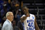 CHARLOTTE, NC - MARCH 20:  Harrison Barnes #40 talks with head coach Roy Williams of the North Carolina Tar Heels while taking on the Washington Huskies during the third round of the 2011 NCAA men's basketball tournament at Time Warner Cable Arena on March 20, 2011 in Charlotte, North Carolina.  (Photo by Streeter Lecka/Getty Images)