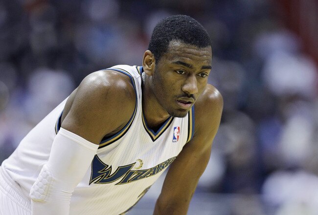 WASHINGTON, DC - MARCH 14: John Wall #2 of the Washington Wizards looks on against the Oklahoma City Thunderduring the second half at the Verizon Center on March 14, 2011 in Washington, DC. NOTE TO USER: User expressly acknowledges and agrees that, by downloading and/or using this Photograph, User is consenting to the terms and conditions of the Getty Images License Agreement.  (Photo by Rob Carr/Getty Images)