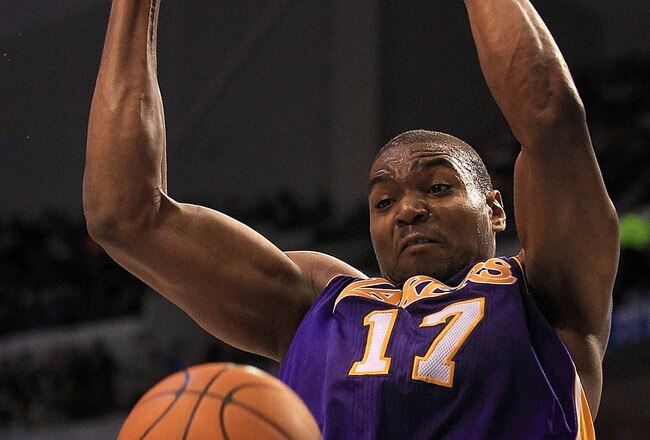 DALLAS, TX - MARCH 12:  Center Andrew Bynum #17 of the Los Angeles Lakers gets the slam dunk against the Dallas Mavericks at American Airlines Center on March 12, 2011 in Dallas, Texas.  NOTE TO USER: User expressly acknowledges and agrees that, by downloading and or using this photograph, User is consenting to the terms and conditions of the Getty Images License Agreement.  (Photo by Ronald Martinez/Getty Images)