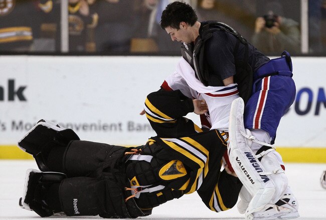 BOSTON, MA - FEBRUARY 09:  Tim Thomas #30 of the Boston Bruins and Carey Price #31 of the Montreal Canadiens fight in the second period on February 9, 2011 at the TD Garden in Boston, Massachusetts.  (Photo by Elsa/Getty Images)