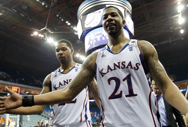 TULSA, OK - MARCH 20:  Marcus Morris #22 and Markieff Morris #21 of the Kansas Jayhawks walk off the court after defeating the Illinois Fighting Illini 59-73 in the third round of the 2011 NCAA men's basketball tournament at BOK Center on March 20, 2011 in Tulsa, Oklahoma.  (Photo by Tom Pennington/Getty Images)