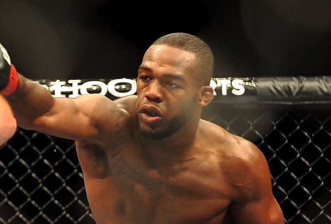 LAS VEGAS - JULY 11:  (R-L) Jon Jones connects with a right punch on Jake O'Brein during their light heavyweight bout during UFC 100 on July 11, 2009 in Las Vegas, Nevada. Jones defeated O'Brein by second round tapout.  (Photo by Jon Kopaloff/Getty Images)
