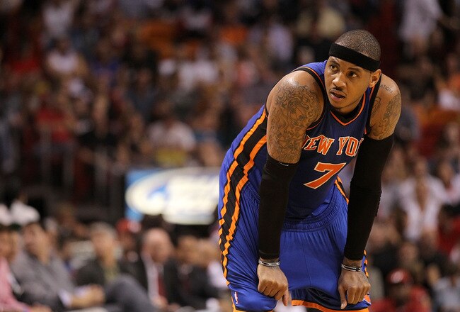 MIAMI, FL - FEBRUARY 27:  Carmelo Anthony #7 of the New York Knicks stands on the court during a game against the Miami Heat at American Airlines Arena on February 27, 2011 in Miami, Florida. NOTE TO USER: User expressly acknowledges and agrees that, by downloading and/or using this Photograph, User is consenting to the terms and conditions of the Getty Images License Agreement.  (Photo by Mike Ehrmann/Getty Images)