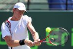 KEY BISCAYNE, FL - MARCH 23:  Kevin Anderson of South Africa hits a backhand return against Nikolay Davydenko of Russia during the Sony Ericsson Open at Crandon Park Tennis Center on March 23, 2011 in Key Biscayne, Florida.  (Photo by Al Bello/Getty Images)