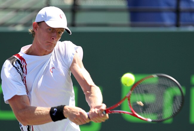 KEY BISCAYNE, FL - MARCH 23:  Kevin Anderson of South Africa hits a backhand return against Nikolay Davydenko of Russia during the Sony Ericsson Open at Crandon Park Tennis Center on March 23, 2011 in Key Biscayne, Florida.  (Photo by Al Bello/Getty Images)