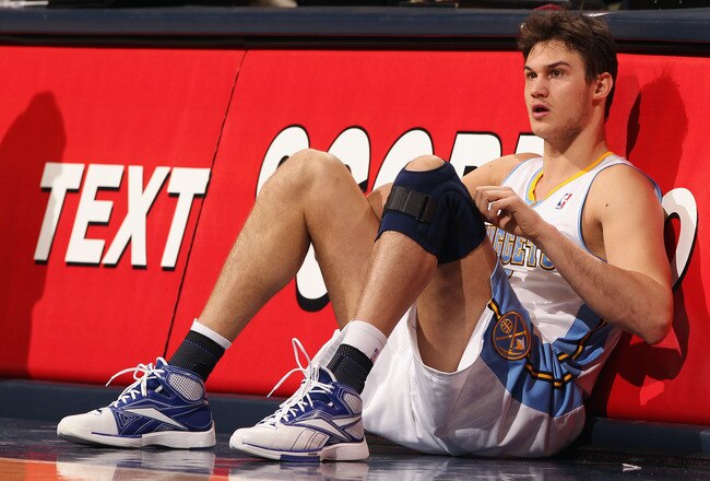 DENVER, CO - FEBRUARY 24:  Danilo Gallinari #8 of the Denver Nuggets adjusts his knee brace as he prepares to reenter the game against the Boston Celtics during NBA action at the Pepsi Center on February 24, 2011 in Denver, Colorado. The Nuggets defeated the Celtics 89-75. NOTE TO USER: User expressly acknowledges and agrees that, by downloading and or using this photograph, User is consenting to the terms and conditions of the Getty Images License Agreement.  (Photo by Doug Pensinger/Getty Images)