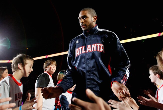 ATLANTA, GA - MARCH 08:  Al Horford #15 of the Atlanta Hawks enters the court during introductions before facing the Los Angeles Lakers at Philips Arena on March 8, 2011 in Atlanta, Georgia.  NOTE TO USER: User expressly acknowledges and agrees that, by downloading and/or using this Photograph, user is consenting to the terms and conditions of the Getty Images License Agreement.  (Photo by Kevin C. Cox/Getty Images)