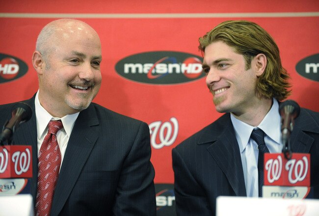 WASHINGTON, DC - DECEMBER 15:  Executive Vice President of Baseball Operations and General Manager Mike Rizzo introduces Jayson Werth #28  of the Washington Nationals to the media on December 15, 2010 at Nationals Park in Washington, DC.   (Photo by Mitchell Layton/Getty Images)