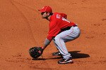 GOODYEAR, AZ - FEBRUARY 27:  Joey Votto #19 of the Cincinnati Reds gets ready to make a play against the Cleveland Indians at Goodyear Ballpark on February 27, 2011 in Goodyear, Arizona.  (Photo by Norm Hall/Getty Images)