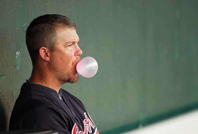 KISSIMMEE, FL - MARCH 01:  Chipper Jones #10 of the Atlanta Braves looks on from the dugout during a Spring Training game against the Houston Astros at Osceola County Stadium on March 1, 2011 in Kissimmee, Florida.  (Photo by Mike Ehrmann/Getty Images)