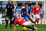 WIGAN, ENGLAND - FEBRUARY 26:  James McCarthy of Wigan Athletic competes with Paul Scholes of Manchester United during the Barclays Premier League match between Wigan Athletic and Manchester United at the DW Stadium on February 26, 2011 in Wigan, England. (Photo by Mike Hewitt/Getty Images)
