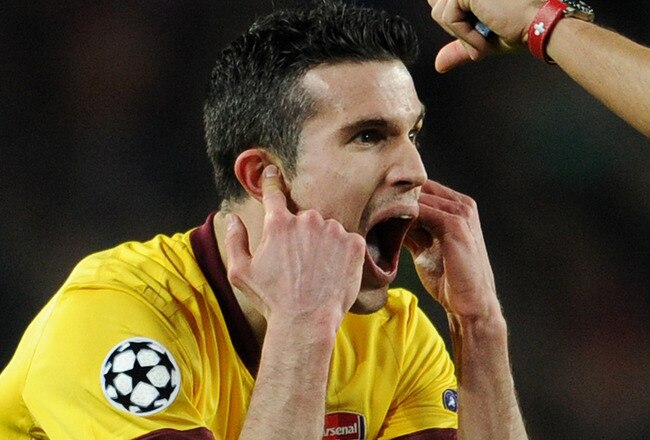 BARCELONA, SPAIN - MARCH 08:  Robin van Persie of Arsenal reacts to referee Massimo Busacca after receiving a red card during the UEFA Champions League round of 16 second leg match between Barcelona and Arsenal on March 8, 2011 in Barcelona, Spain.  (Photo by Jasper Juinen/Getty Images)