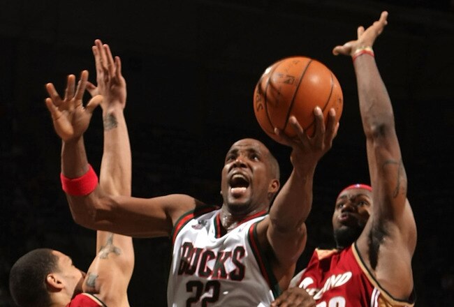 MILWAUKEE - FEBRUARY 26: Michael Redd #22 of the Milwaukee Bucks drives to the basket for a shot between Dwayne Jones #27 and LeBron James #23 of the Cleveland Cavaliers on February 26, 2008 at the Bradley Center in Milwaukee, Wisconsin. The Bucks defeated the Cavaliers 105-102. NOTE TO USER: User expressly acknowledges and agreees that, by downloading and/or using this Photograph, User is consenting to the terms and conditions of the Getty Images License Agreement. (Photo by Jonathan Daniel/Getty Images)