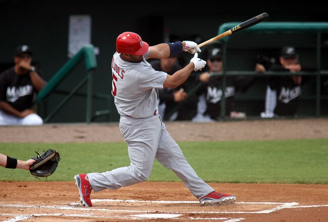 JUPITER, FL - MARCH 06:  First baseman Albert Pujols #5 of the St. Louis Cardinals bats against the Florida Marlins at Roger Dean Stadium on March 6, 2011 in Jupiter, Florida.  (Photo by Marc Serota/Getty Images)