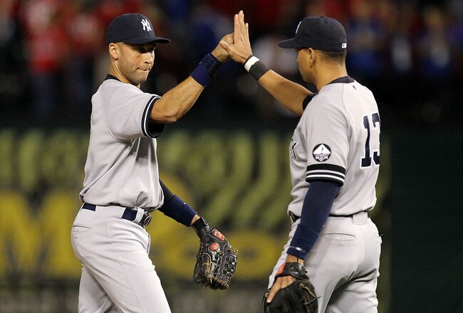ARLINGTON, TX - OCTOBER 15:  (L-R) Derek Jeter #2 and Alex Rodriguez #13 of the New York Yankees celebrate after the Yankees won 6-5 against the Texas Rangers in Game One of the ALCS during the 2010 MLB Playoffs at Rangers Ballpark in Arlington on October 15, 2010 in Arlington, Texas.  (Photo by Ronald Martinez/Getty Images)