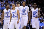 NEWARK, NJ - MARCH 25:  Dexter Strickland #1, Kendall Marshall #5, John Henson #31 and Harrison Barnes #40  of the North Carolina Tar Heels walk on the court after a play against the Marquette Golden Eagles during the east regional semifinal of the 2011 NCAA Men's Basketball Tournament at the Prudential Center on March 25, 2011 in Newark, New Jersey.  (Photo by Chris Trotman/Getty Images)