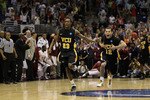 SAN ANTONIO, TX - MARCH 25:  Rob Brandenberg #23 and Joey Rodriguez #12 of the Virginia Commonwealth Rams celebrate after defeating the Florida State Seminoles during the southwest regional of the 2011 NCAA men's basketball tournament at the Alamodome on March 25, 2011 in San Antonio, Texas.  (Photo by Ronald Martinez/Getty Images)