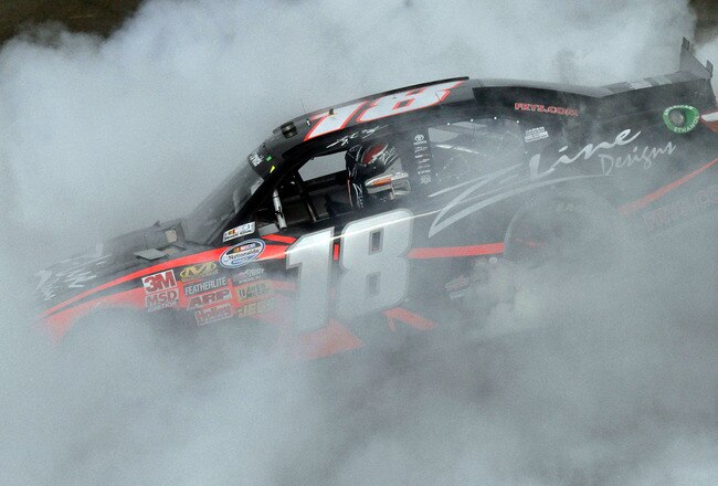 FONTANA, CA - MARCH 26:  Kyle Busch, driver of the #18 Z-Line Designs Toyota, performs a burnout after winning the NASCAR Nationwide Series Royal Purple 300 at Auto Club Speedway on March 26, 2011 in Fontana, California.  (Photo by Jason Smith/Getty Images for NASCAR)