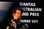MELBOURNE, AUSTRALIA - MARCH 27:  Sebastian Vettel of Germany and Red Bull Racing celebrates on the podium after winning the Australian Formula One Grand Prix at the Albert Park Circuit on March 27, 2011 in Melbourne, Australia.  (Photo by Clive Mason/Getty Images)