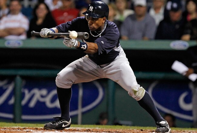 FORT MYERS, FL - MARCH 14:  Outfielder Curtis Granderson #14 of the New York Yankees bunts for a single against the Boston Red Sox during a Grapefruit League Spring Training Game at City of Palms Park on March 14, 2011 in Fort Myers, Florida.  (Photo by J. Meric/Getty Images)