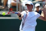 KEY BISCAYNE, FL - MARCH 27:  Kevin Anderson of South Africa hits a forehand against Pablo Andujar of Spain during the Sony Ericsson Open at Crandon Park Tennis Center on March 27, 2011 in Key Biscayne, Florida.  (Photo by Clive Brunskill/Getty Images)