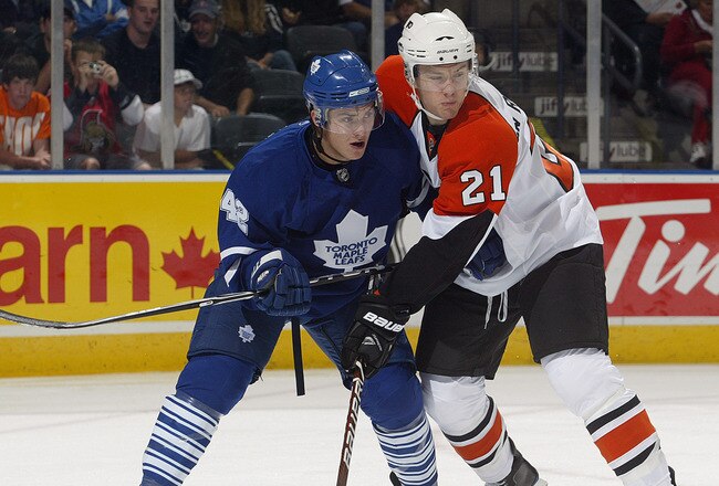 LONDON, ON - SEPTEMBER 17:  Tyler Bozak #42 of the Toronto Maple Leafs battles with James Van Reimsdyk #21 of the Philadelphia Flyers in a preseason game on September 17, 2009 at the John Labatt Centre in London, Ontario. The Leafs defeated the Flyers 4-0. (Photo by Claus Andersen/Getty Images)
