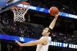 TAMPA, FL - MARCH 19:  Josh Harrellson #55 of the Kentucky Wildcats attempts a dunk against the West Virginia Mountaineers during the third round of the 2011 NCAA men's basketball tournament at St. Pete Times Forum on March 19, 2011 in Tampa, Florida.  (Photo by J. Meric/Getty Images)