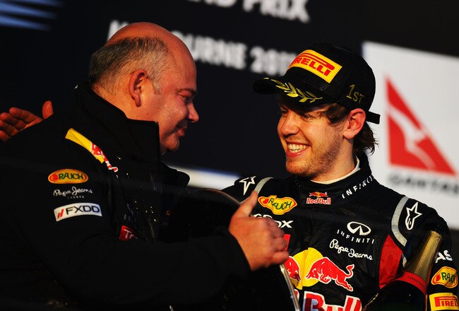 MELBOURNE, AUSTRALIA - MARCH 27:  Sebastian Vettel (R) of Germany and Red Bull Racing celebrates on the podium with Red Bull Racing Chief Designer Rob Marshall after winning the Australian Formula One Grand Prix at the Albert Park Circuit on March 27, 2011 in Melbourne, Australia.  (Photo by Clive Mason/Getty Images)
