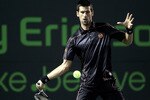 KEY BISCAYNE, FL - MARCH 27:  Novak Djokovic of Serbia hits a forehand return against James Blake during the Sony Ericsson Open at Crandon Park Tennis Center on March 27, 2011 in Key Biscayne, Florida.  (Photo by Matthew Stockman/Getty Images)