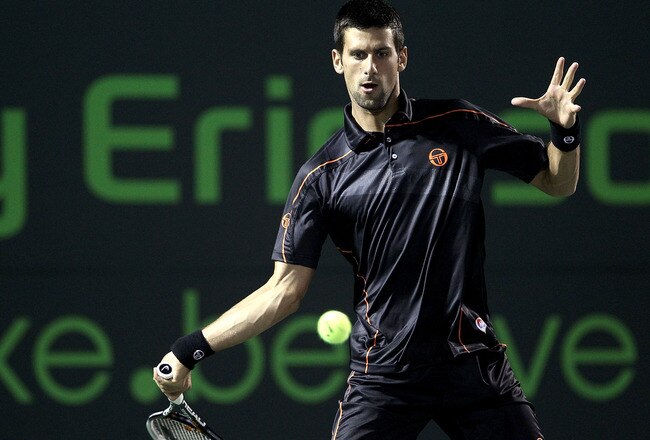 KEY BISCAYNE, FL - MARCH 27:  Novak Djokovic of Serbia hits a forehand return against James Blake during the Sony Ericsson Open at Crandon Park Tennis Center on March 27, 2011 in Key Biscayne, Florida.  (Photo by Matthew Stockman/Getty Images)
