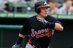 JUPITER, FL - MARCH 17:  Nate McLouth #24 of the Atlanta Braves hits a single against the Florida Marlins at Roger Dean Stadium on March 17, 2010 in Jupiter, Florida.  (Photo by Doug Benc/Getty Images)