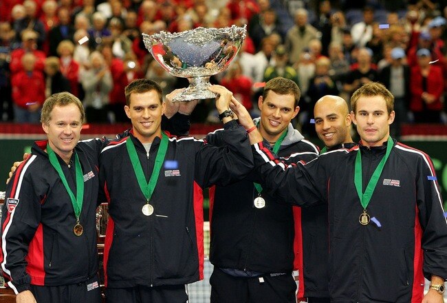PORTLAND, OR - DECEMBER 02:  Team USA, (L-R) Captain Patrick McEnroe, Mike Bryan, Bob Bryan, James Blake and Andy Roddick, hoist the Davis Cup trophy after defeating Russia 4-1 during the final day of  the Davis Cup Final at the Memorial Coliseum on December 2, 2007 in Portland, Oregon.  (Photo by Jonathan Ferrey/Getty Images)