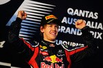 MELBOURNE, AUSTRALIA - MARCH 27:  Sebastian Vettel of Germany and Red Bull Racing celebrates on the podium after winning the Australian Formula One Grand Prix at the Albert Park Circuit on March 27, 2011 in Melbourne, Australia.  (Photo by Clive Mason/Getty Images)