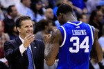 NEWARK, NJ - MARCH 27:  Head coach John Calipari (L) hugs DeAndre Liggins (R) #34 of the Kentucky Wildcats after defeating the North Carolina Tar Heels in the east regional final of the 2011 NCAA men's basketball tournament at Prudential Center on March 27, 2011 in Newark, New Jersey.  (Photo by Chris Trotman/Getty Images)