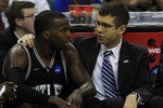 NEW ORLEANS, LA - MARCH 26:  Shelvin Mack #1 of the Butler Bulldogs talks to head coach Brad Stevens during their 74 to 71 win over the Florida Gators during the Southeast regional final of the 2011 NCAA men's basketball tournament at New Orleans Arena on March 26, 2011 in New Orleans, Louisiana.  (Photo by Streeter Lecka/Getty Images)