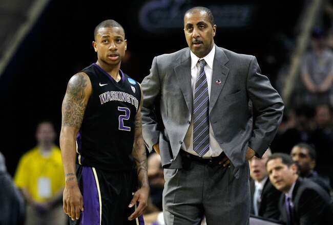 CHARLOTTE, NC - MARCH 20:  Isaiah Thomas #2 talks with head coach Lorenzo Romar of the Washington Huskies while taking on the North Carolina Tar Heels during the third round of the 2011 NCAA men's basketball tournament at Time Warner Cable Arena on March 20, 2011 in Charlotte, North Carolina.  (Photo by Kevin C. Cox/Getty Images)