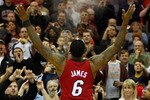 CLEVELAND - MARCH 29: LeBron James #6 of the Miami Heat performs his pre-game chalk throw ritual before the game against the Cleveland Cavaliers on March 29, 2011 at Quicken Loans Arena in Cleveland, Ohio. NOTE TO USER: User expressly acknowledges and agrees that, by downloading and/or using this Photograph, user is consenting to the terms and conditions of the Getty Images License Agreement.  (Photo by Jared Wickerham/Getty Images)