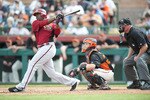 SCOTTSDALE, AZ - FEBRUARY 25: Justin Upton #10 of the Arizona Diamondbacks bats during a spring training game San Francisco Giant at Scottsdale Stadium on February 25, 2011 in Scottsdale, Arizona. (Photo by Rob Tringali/Getty Images)