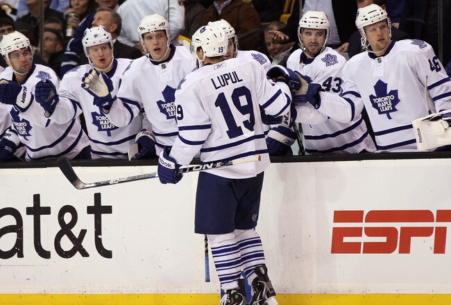 BOSTON, MA - MARCH 31:  Joffrey Lupul #19 of the Toronto Maple Leafs is congratulated by teamamtes on the bench after he scored a goal in the second period against the Boston Bruins on March 31, 2011 at the TD Garden in Boston, Massachusetts.  (Photo by Elsa/Getty Images)