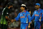 MOHALI, INDIA - MARCH 30: Captain Shahid Afridi of Pakistan congratulates Sachin Tendulkar of India during the 2011 ICC World Cup second Semi-Final between India and Pakistan at Punjab Cricket Association (PCA) Stadium on March 30, 2011 in Mohali, India. (Photo by Daniel Berehulak/Getty Images)