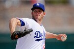 GLENDALE, AZ - MARCH 15:  Pitcher Clayton Kershaw #22 of the Los Angeles Dodgers throws a pitch against Texas Rangers during the spring training baseball game at Camelback Ranch on March 15, 2011 in Glendale, Arizona.  (Photo by Kevork Djansezian/Getty Images)