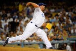 LOS ANGELES, CA - MARCH 31:  Jonathan Broxton #51 of the Los Angeles Dodgers throws a pitch in the ninth inning against the San Francisco Giants on Opening Day at Dodger Stadium on March 31, 2011 in Los Angeles, California.  (Photo by Kevork Djansezian/Getty Images)