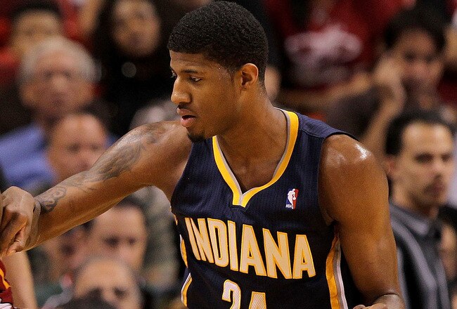MIAMI, FL - FEBRUARY 08:  LeBron James #6 of the Miami Heat posts up Paul George #24 of the Indiana Pacers during a game at American Airlines Arena on February 8, 2011 in Miami, Florida. NOTE TO USER: User expressly acknowledges and agrees that, by downloading and/or using this Photograph, User is consenting to the terms and conditions of the Getty Images License Agreement.  (Photo by Mike Ehrmann/Getty Images)