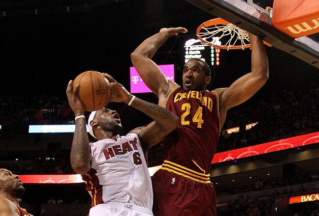MIAMI, FL - JANUARY 31:  LeBron James #6 of the Miami Heat takes a shot against Samardo Samuels #24 of the Cleveland Cavaliers during a game at American Airlines Arena on January 31, 2011 in Miami, Florida. NOTE TO USER: User expressly acknowledges and agrees that, by downloading and/or using this Photograph, User is consenting to the terms and conditions of the Getty Images License Agreement.  (Photo by Mike Ehrmann/Getty Images)
